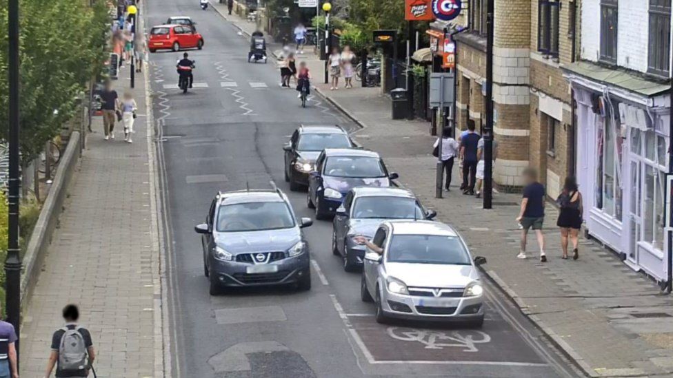 Car driving the wrong way down a road