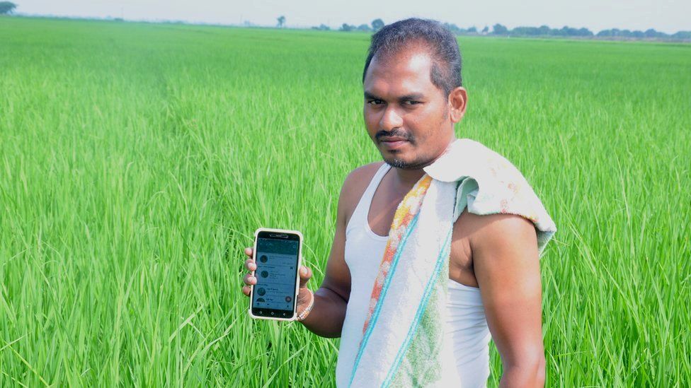 Rice farmer Voruganti Surendra in paddy field