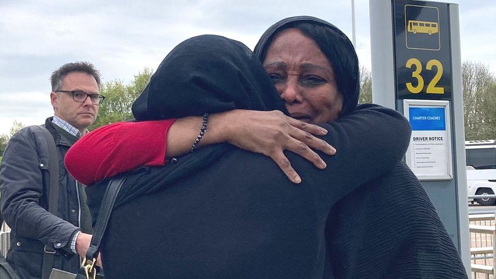 Woman hugs sister at Stansted Airport after evacuation from Sudan