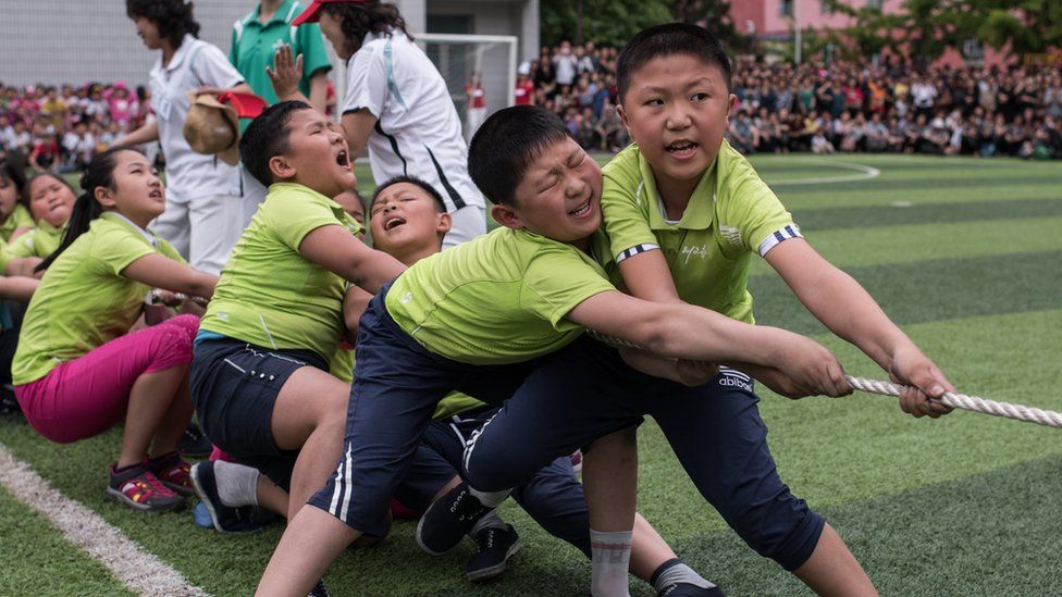 Schoolchildren playing tug-of-war in Pyongyang
