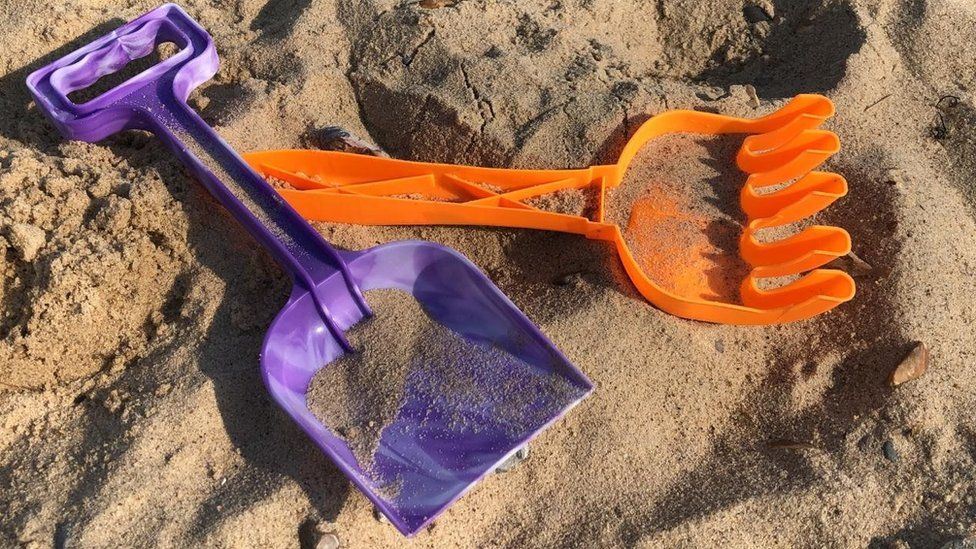 A spade and fork on Great Yarmouth beach
