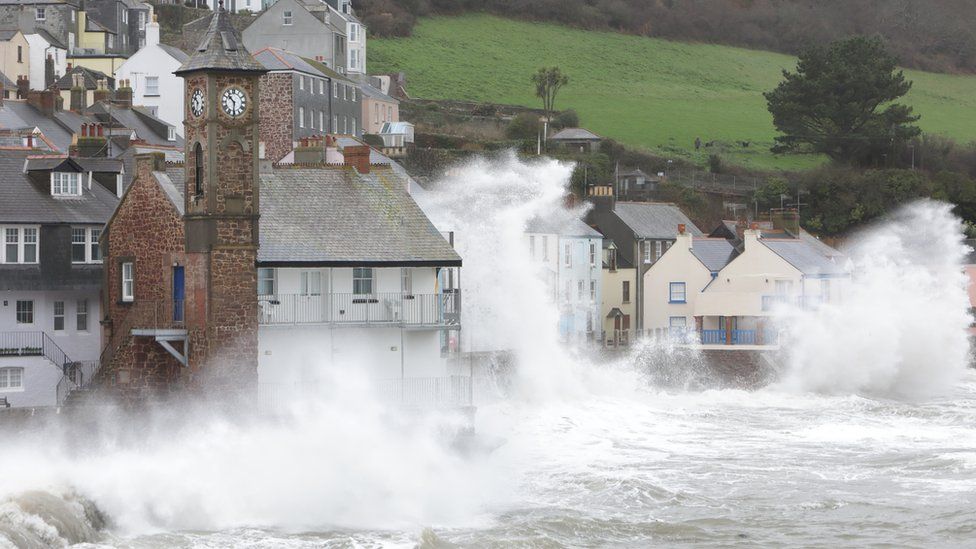 Storms and high seas affecting a village