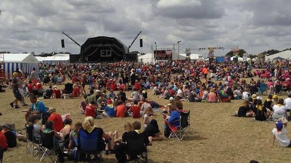 Scouts gathered in front of a stage at Essex International Jamboree