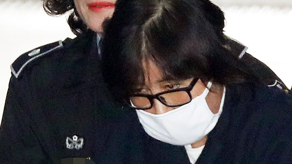 Choi Soon-Sil is escorted into the Seoul Central District Prosecutor's Office in Seoul on 3 November 2016.