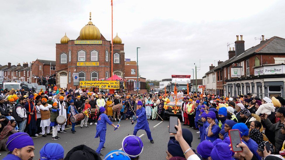 A Sikh martial arts demonstration is given outside the Gurdwara Nanaksar as people take part in the Nagar Kirtan procession through the city centre in Southampton,