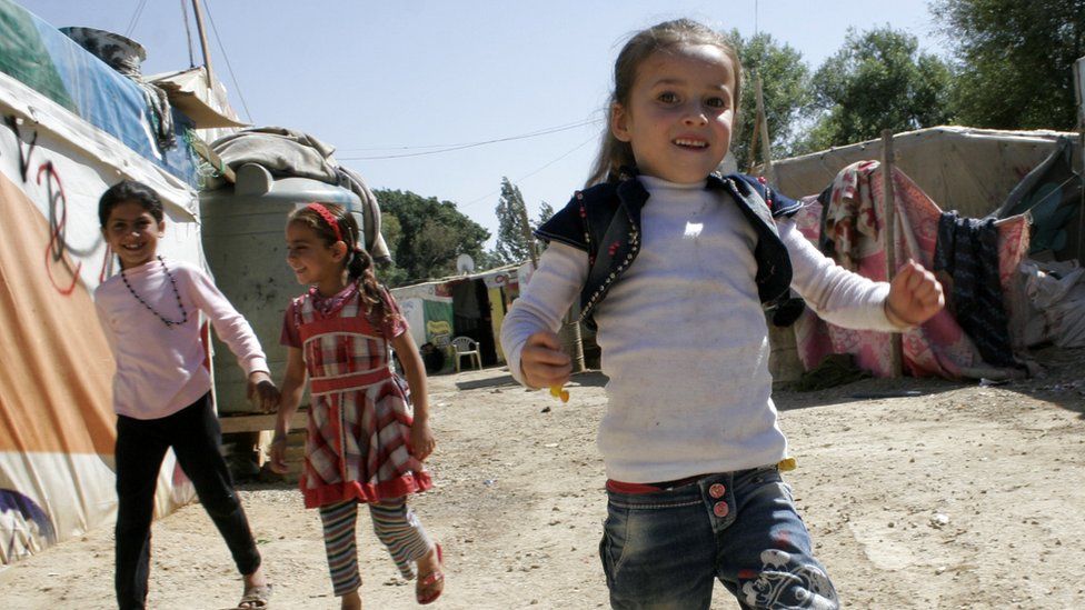 Children play at the Yaqteen refugee camp in Lebanon
