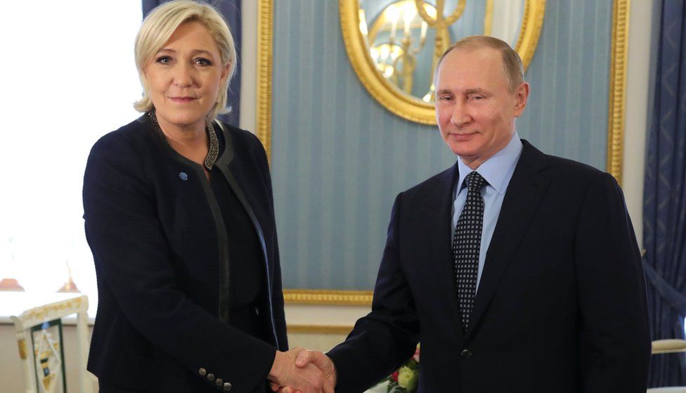 Russian President Vladimir Putin shakes hands with Marine Le Pen, French National Front (FN) on 24 March 2017