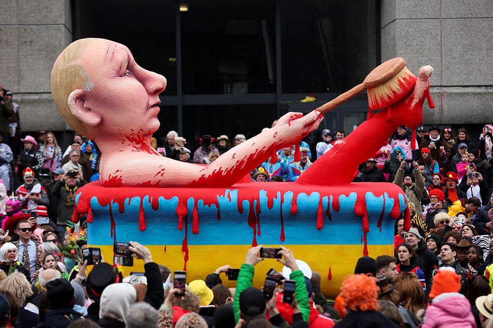 A carnival float depicting Russian President Vladimir Putin taking a bath of blood is seen at the Rosenmontag, or Rose Monday, carnival parade in Duesseldorf, Germany, on 20 February 2023