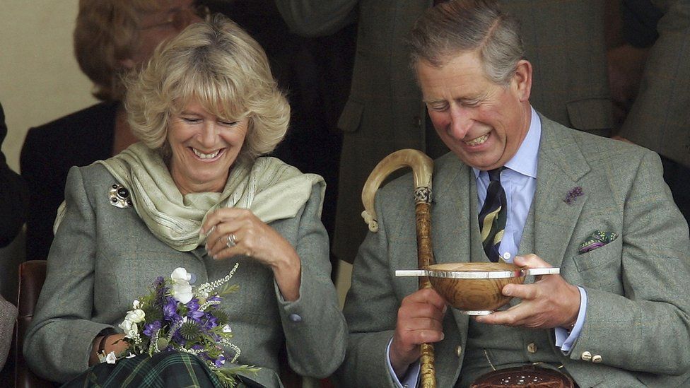 : Prince Charles, the Prince of Wales, and his wife Camilla, the Duchess of Cornwall, in their role as the Duke and Duchess of Rothesay, drink whisky from a Quaich given to them as a wedding gift at the 2005 Mey Games at Queens Park in Mey on August 6, 2005 in Caithness, Scotland. Prince Charles attends smallest games in Scotland near The Castle of Mey, the late Queen Mother's favourite holiday residence. The Duke of Rothesay takes his grandmother's place on the pavilion, having replaced her as honorary chieftain of the games.