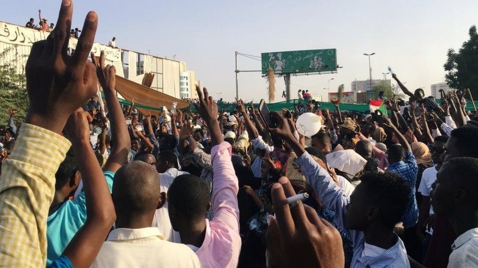 Sudanese demonstrators chant slogans during a protest demanding Sudanese President Omar Al-Bashir to step down