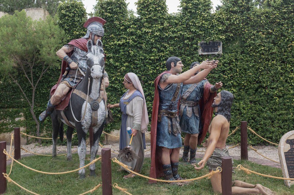 A statue showing Roman soldiers putting the crown of thorns on Jesus