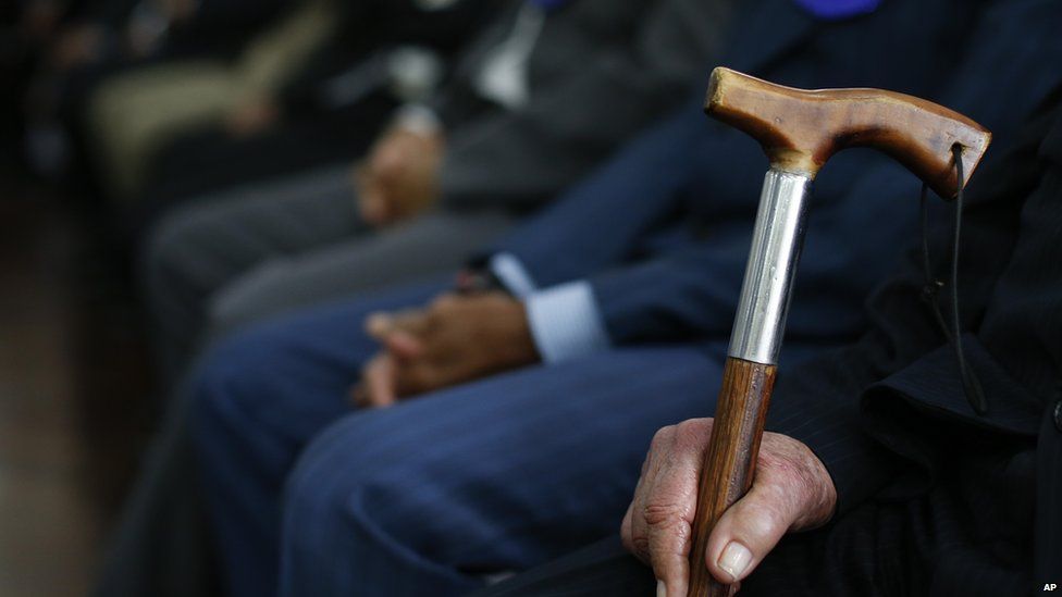A contestant holds his walking stick at Sao Paulo's "Most Handsome Elderly Male" contest