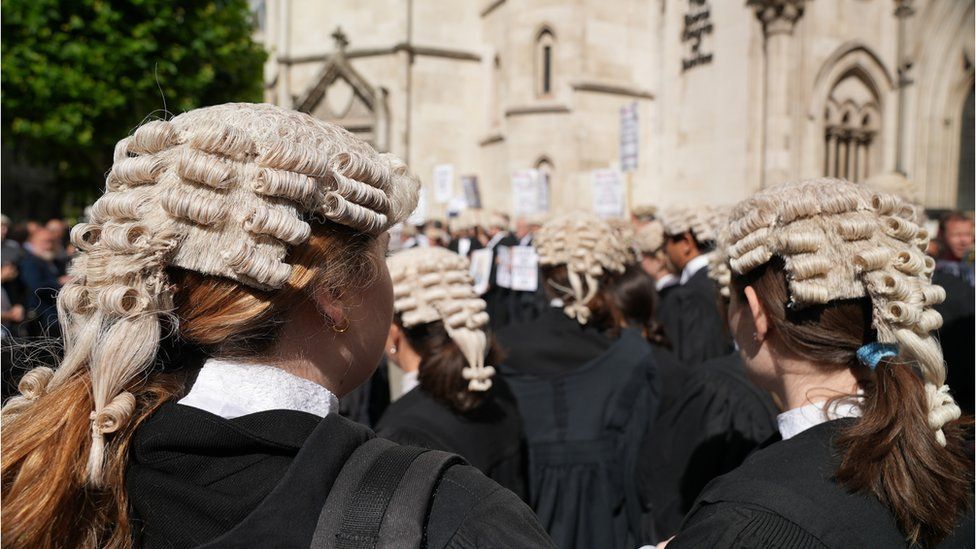 Barristers in wigs rally outside Royal Courts of Justice