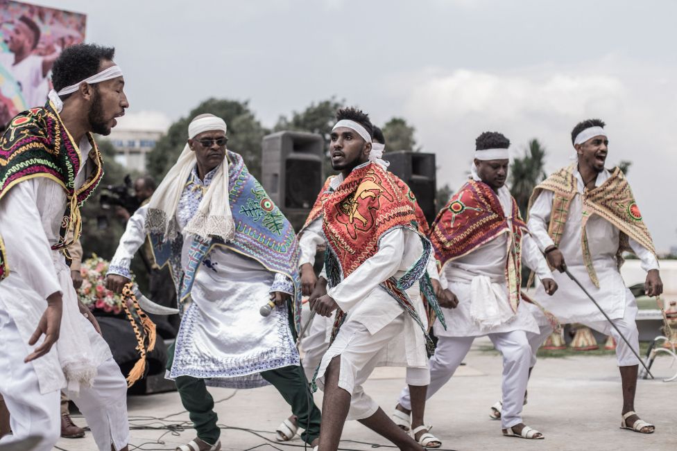 Artists perform during the farewell ceremony of Ethiopian military forces leaving for the Tigray war front, in Addis Ababa, on August 13, 2021