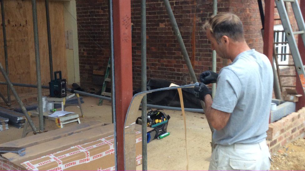 Builder working with aerogel insulation