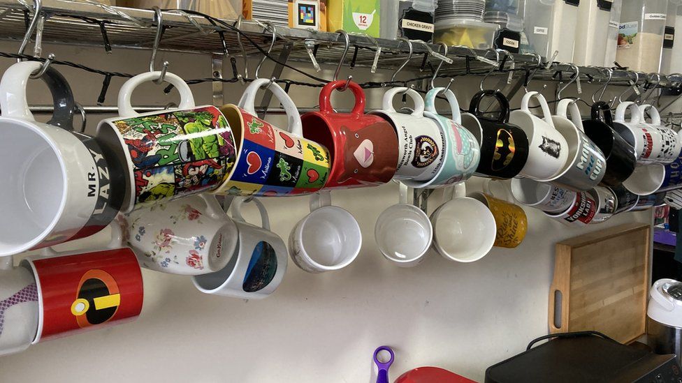 Mugs hanging in Lee's kitchen