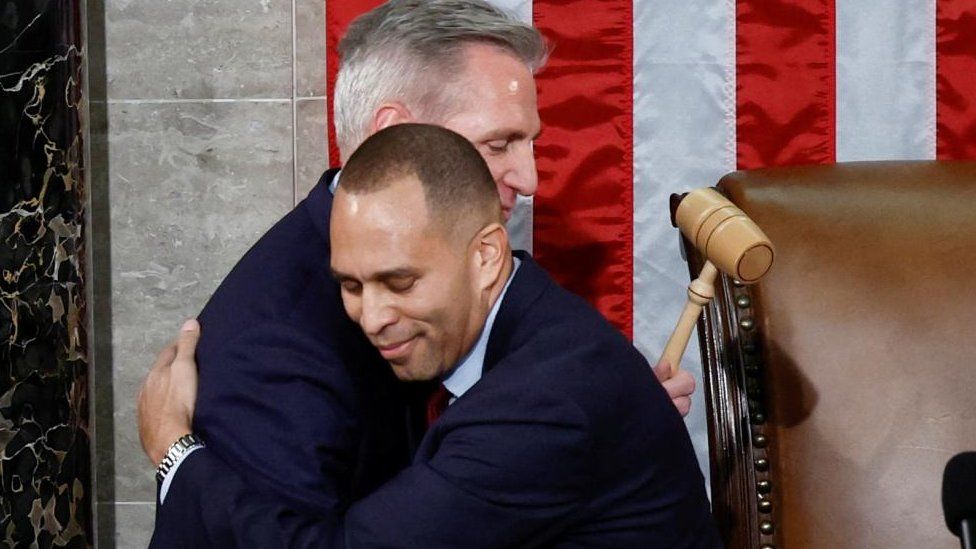 Speaker of the House Kevin McCarthy hugs House Democratic Leader Rep. Hakeem Jeffries after being handed the Speaker's gavel