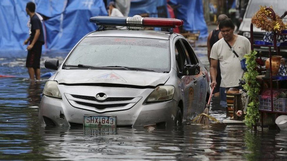 A flooded street in Quezon city, north of Manila. Photo: 26 December 2016
