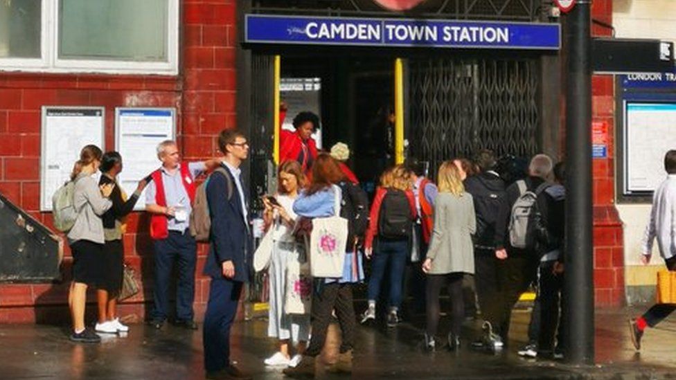 Commuters queue outside Camden station
