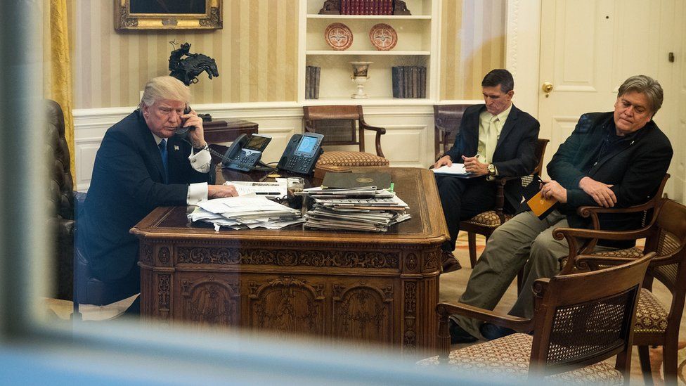 President Donald Trump speaks on the phone with Australian Prime Minister Malcolm Turnbull in the Oval Office of the White House, January 28, 2017 in Washington, DC.