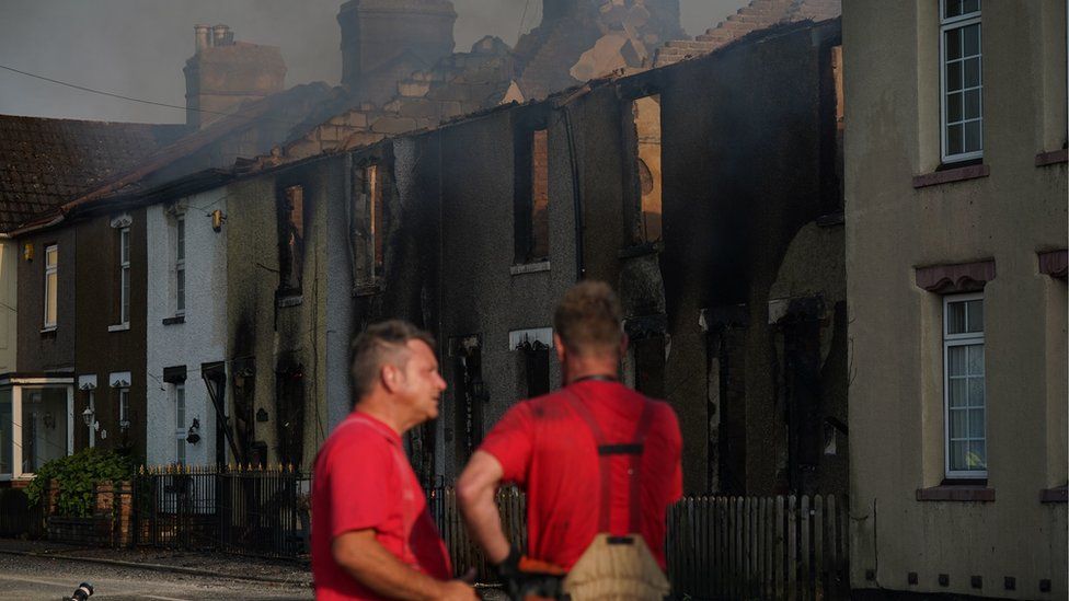 Firefighters at the scene of a blaze in the village of Wennington, east London.