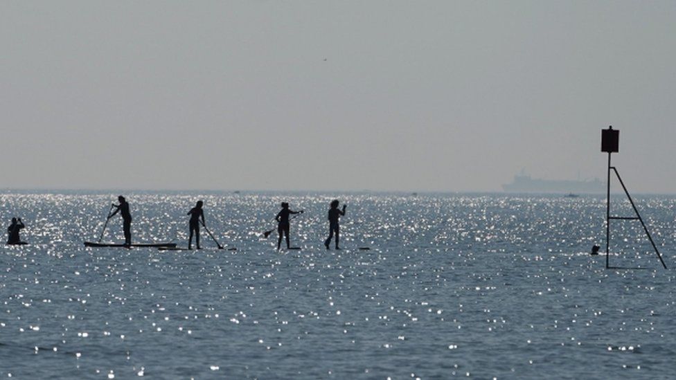 Paddle boarders in the sea