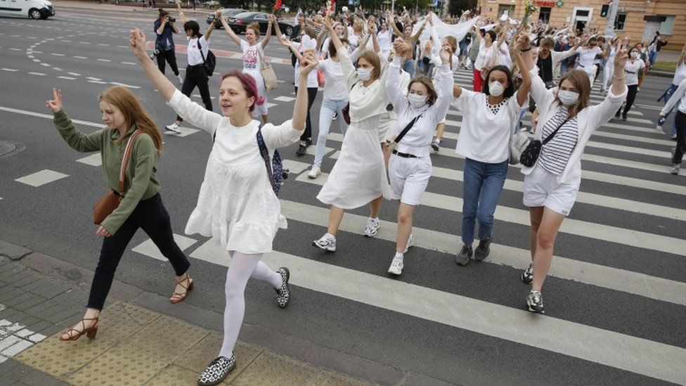 Women rally in support of detained and injured participants of the protests that erupted in the aftermath of the presidential election, in Minsk, Belarus, 12 August 2020