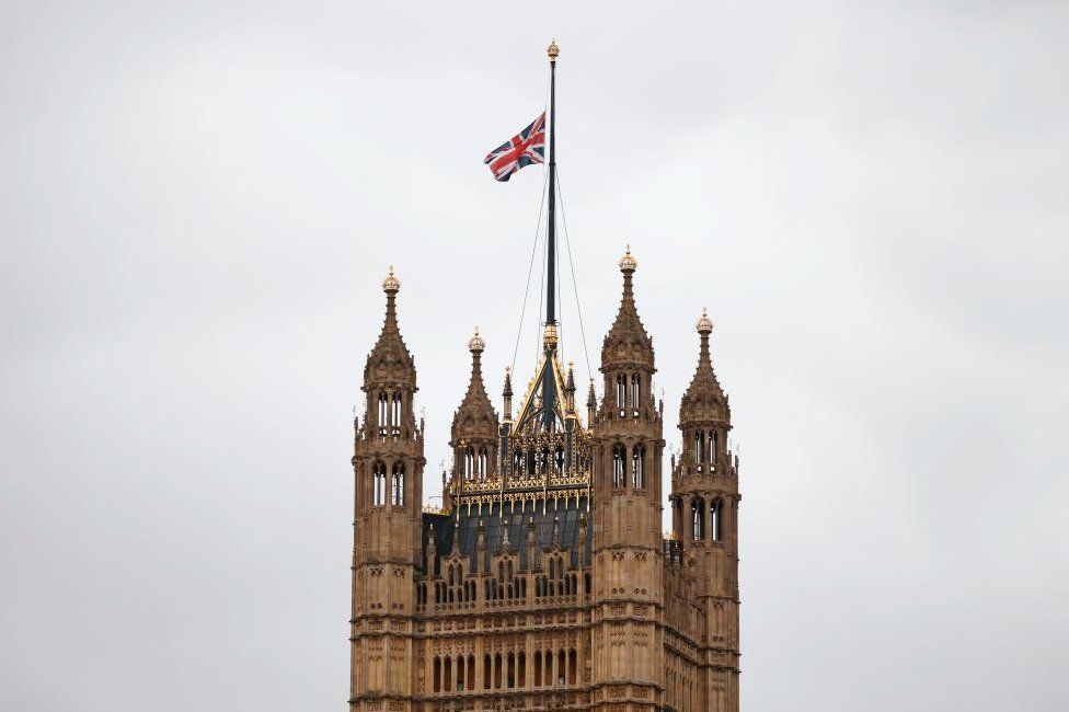 A union jack flies at half mast from the top of Victoria Tower at the Palace of Westminster
