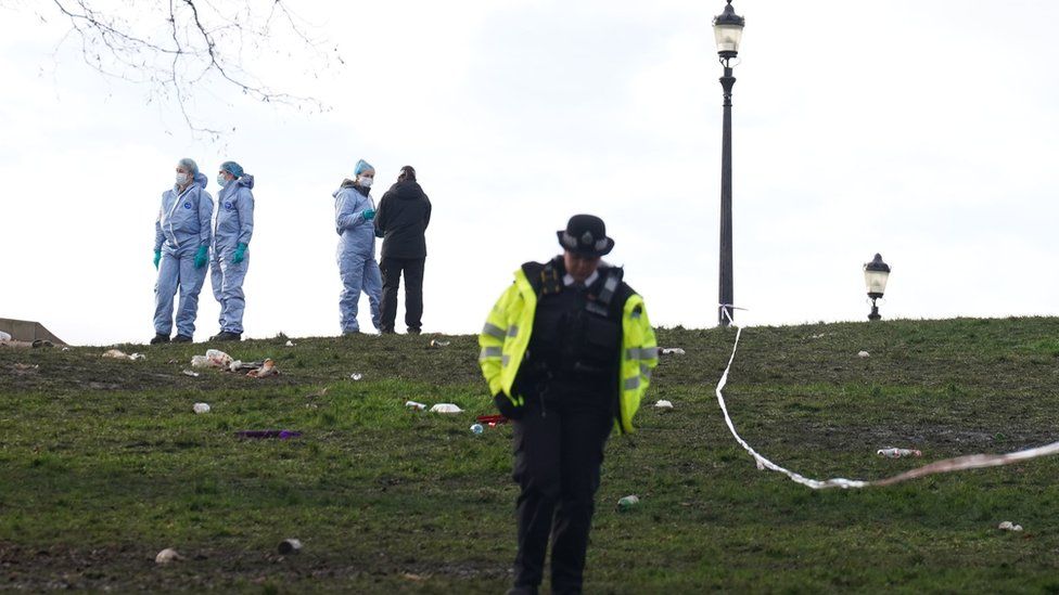 Police officers in forensic suits on Primrose Hill, Camden