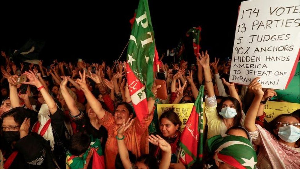 Supporters of the Pakistan Tehreek-e-Insaf (PTI) political party raise their hands during a rally in support of former Pakistani Prime Minister Imran Khan, after he lost a confidence vote in the lower house of parliament, in Islamabad, Pakistan April 10, 2022.