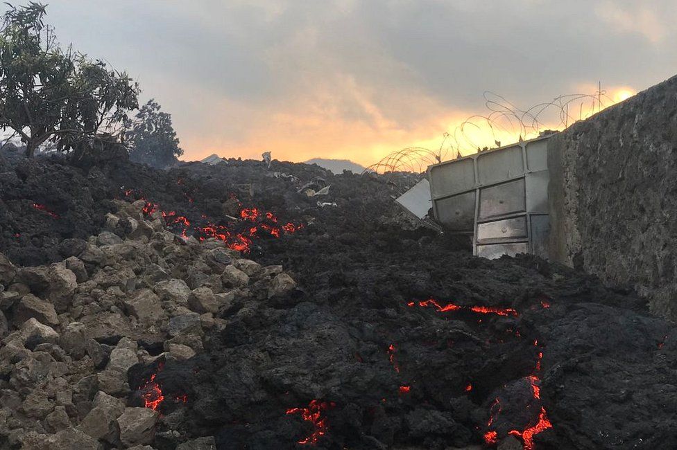 Smouldering ashes are seen early morning in Goma in the East of the Democratic Republic of Congo on 23 May 2021 following the eruption of Mount Nyiragongo