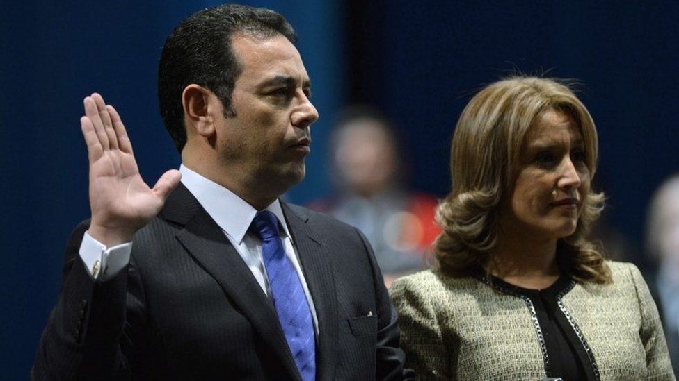 Guatemalan President Jimmy Morales (L) swears in next to his wife Gilda Marroquin during the inauguration ceremony in Guatemala City, on January 14, 2016.