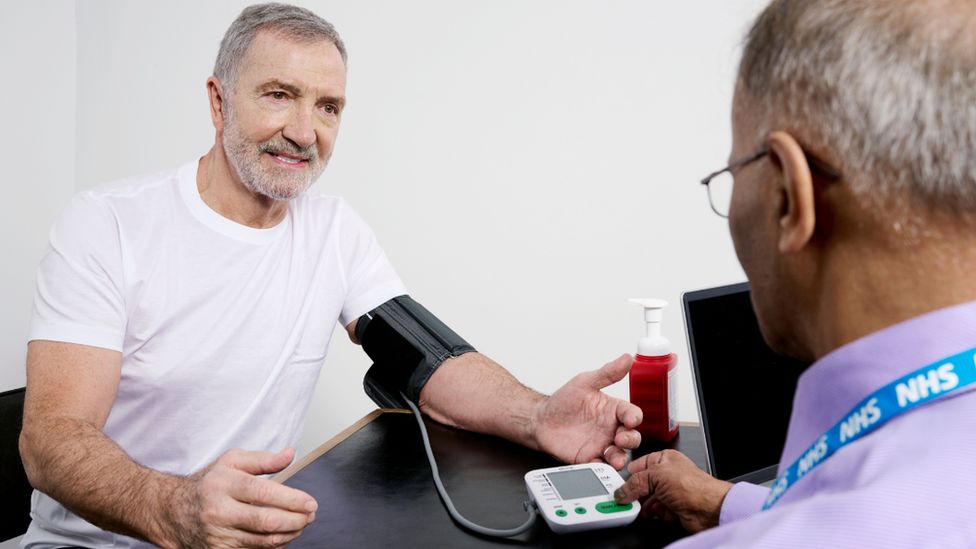 Graeme Souness having his blood pressure checked