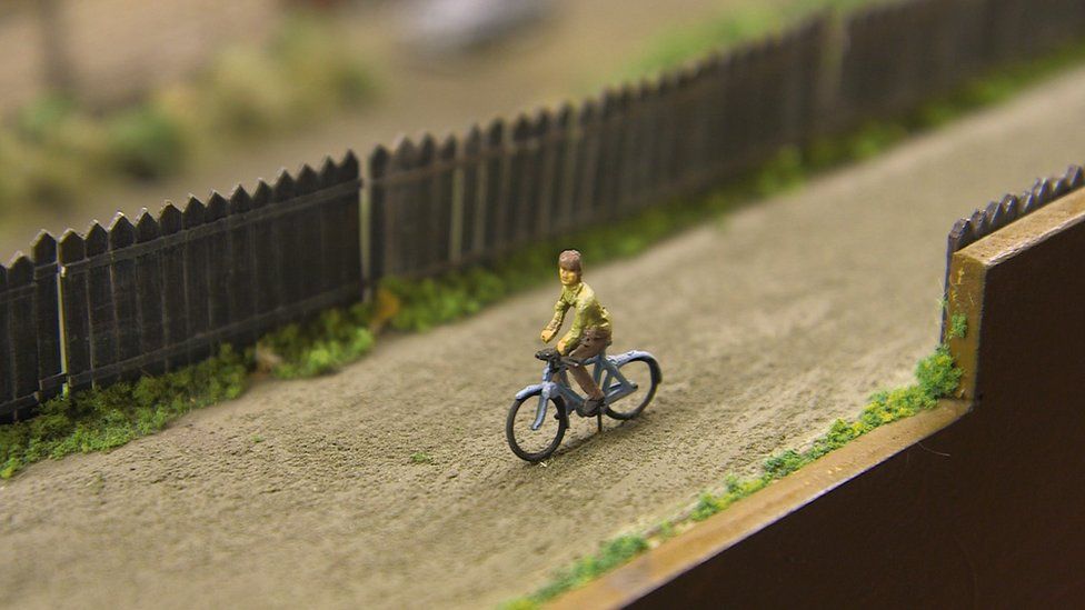 Man on bicycle in Alloa layout