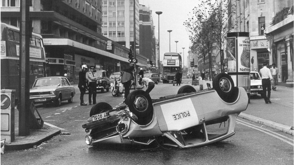 12th August 1975: One on the more basic Police vehicles, the 'Panda', lies upside-down in Oxford Street, London, after an accident. (Photo by Fred Mott/Evening Standard/Getty Images)