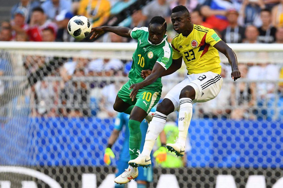 Senegal's forward Sadio Mane (L) heads the ball as he vies for it with Colombia's defender Davinson Sanchez (R) during the Russia 2018 World Cup Group H football match between Senegal and Colombia at the Samara Arena in Samara on June 28, 2018.