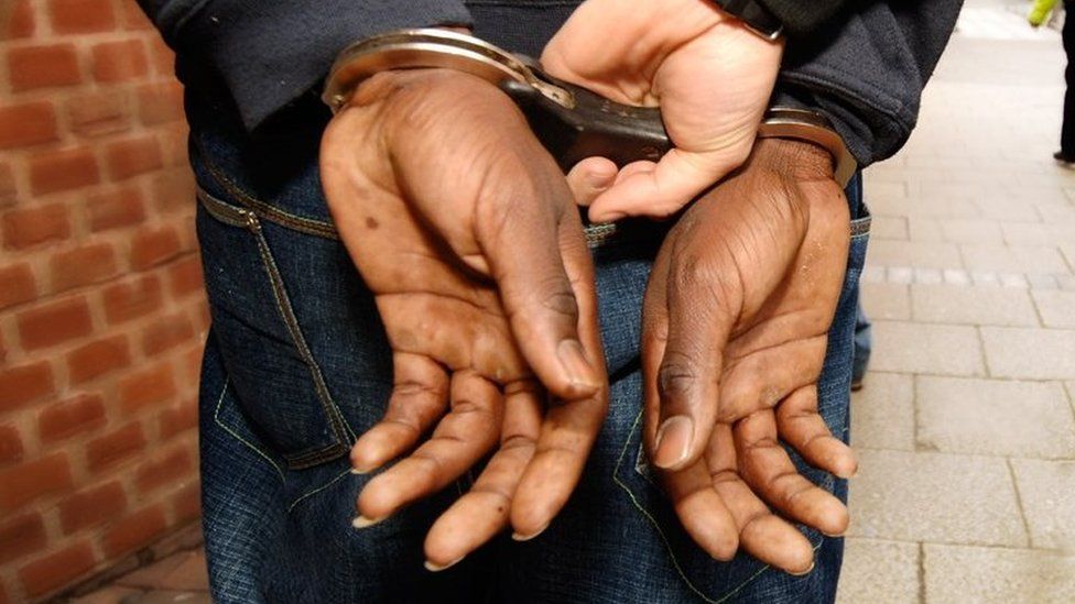 Handcuffed offender