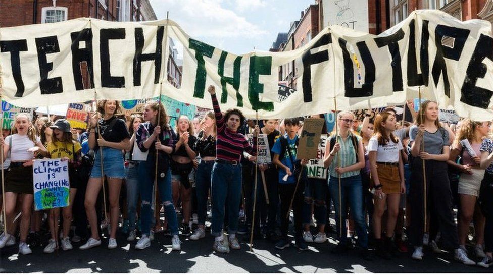 Teach the Future banner at climate demo