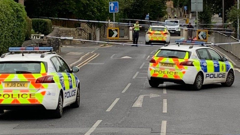 Police scene after boy, 15, stabbed to death in Huddersfield
