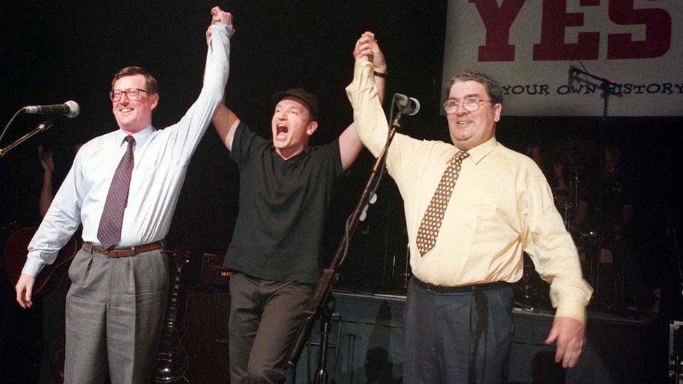 David Trimble, Bono and John Hume pictured together on stage at the Waterfront hall in Belfast