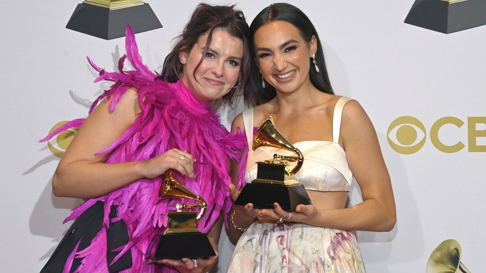 Abigail Barlow and Emily Bear pose with their Grammy trophies