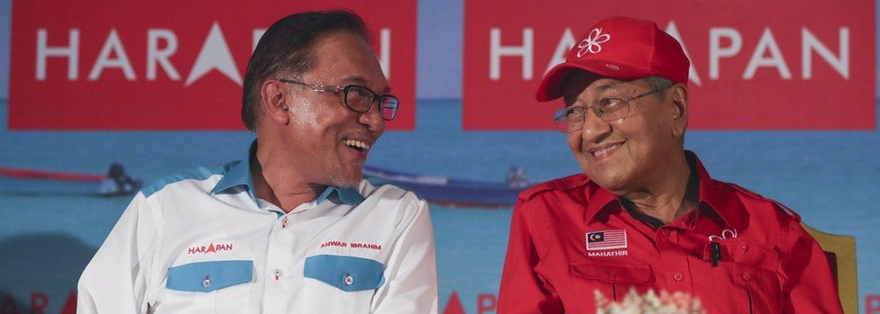 Next the prime minister in waiting Anwar Ibrahim (L) have a chat with Malaysia Prime Minister Mahathir Mohamad (R) during a campaign ahead of by election in Port Dickson