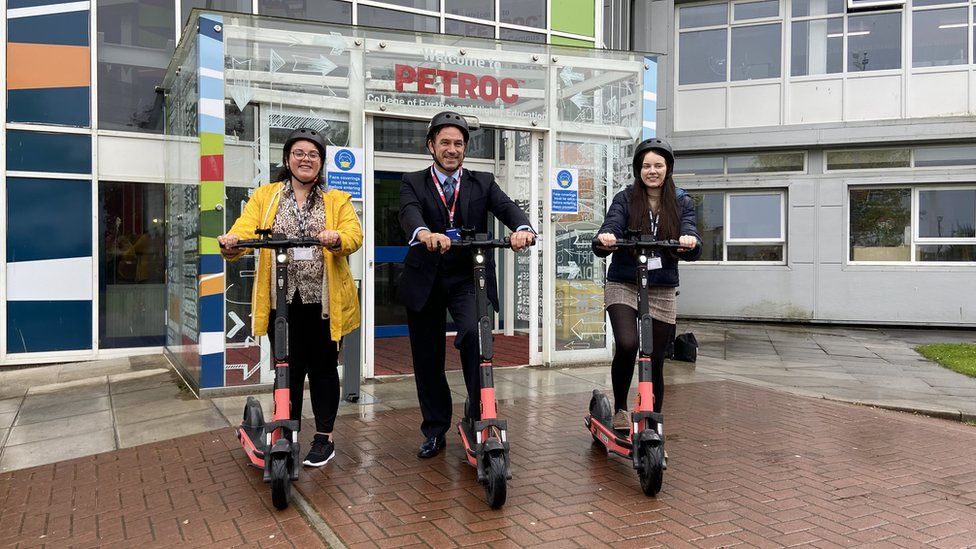 Petroc CEO and students try out the scooters