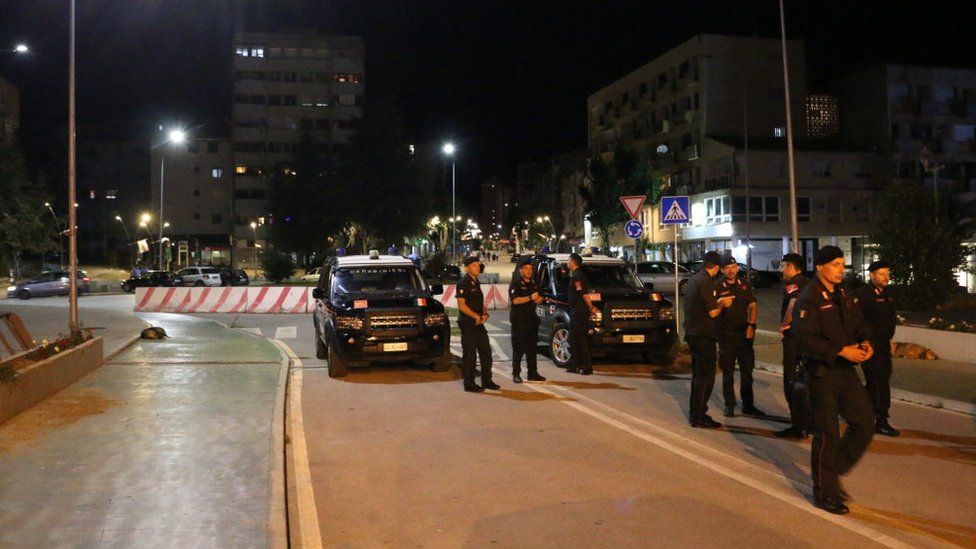 Security forces block the road in the city of Mitrovica near the Kosovo-Serbian border as a security measure