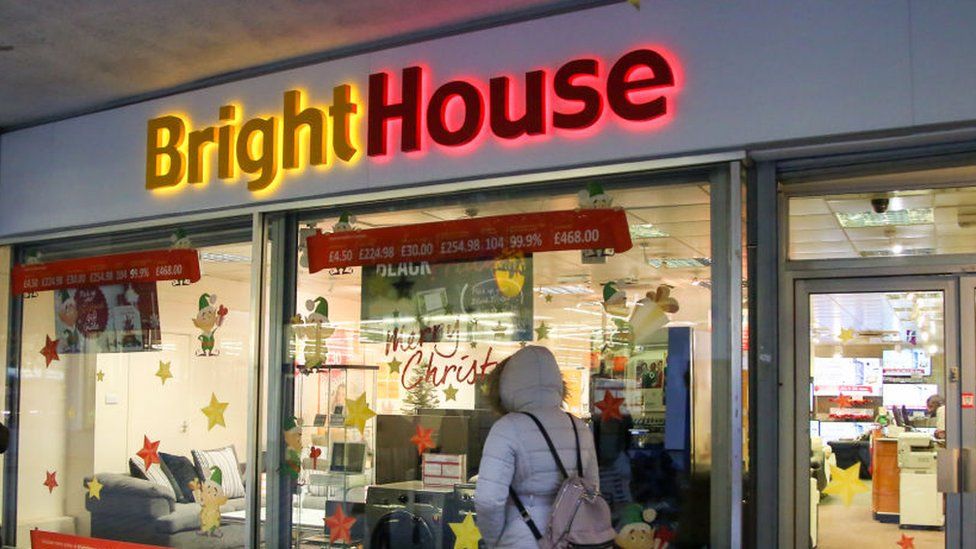 Shopper walks past Bright house