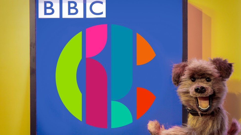 The Hacker T Dog puppet and the CBBC logo