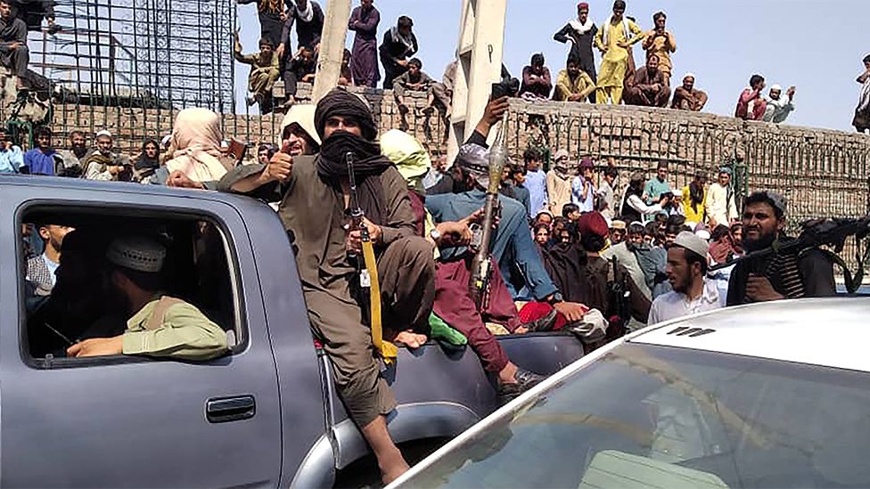 Taliban fighters sit on a vehicle in Jalalabad province, August 15 2021