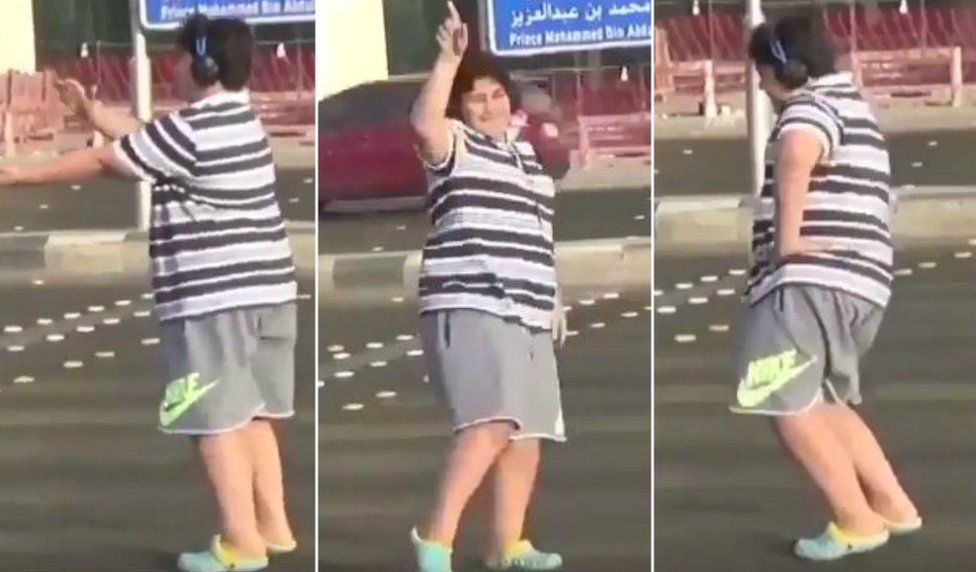 Three collaged screengrabs show a teen wearing a striped shirt and sport shorts at various stages of doing the popular Macarena dance in a Saudi street