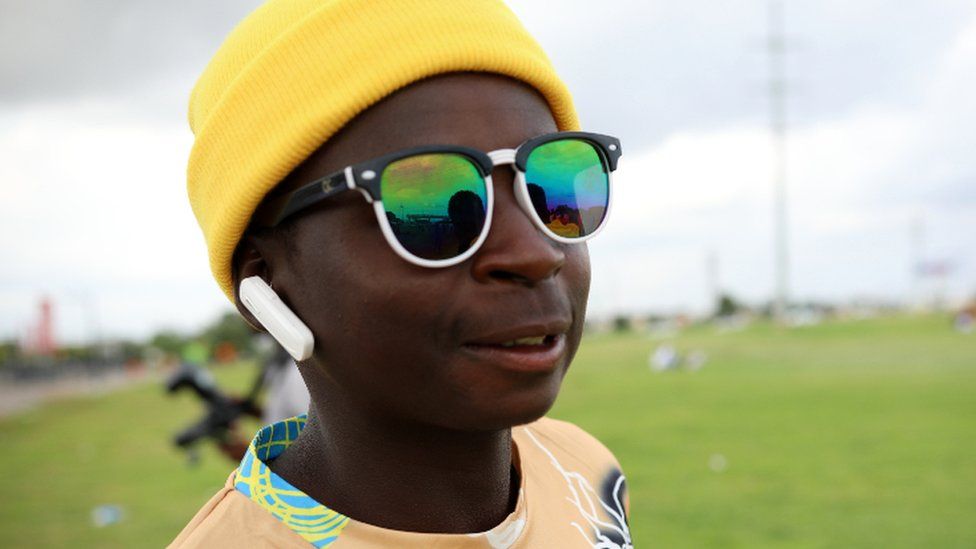 A man with a yellow head warmer