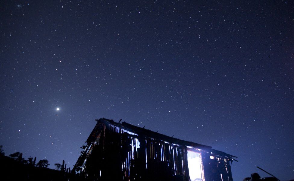 Night sky over a Van Gujjar hut